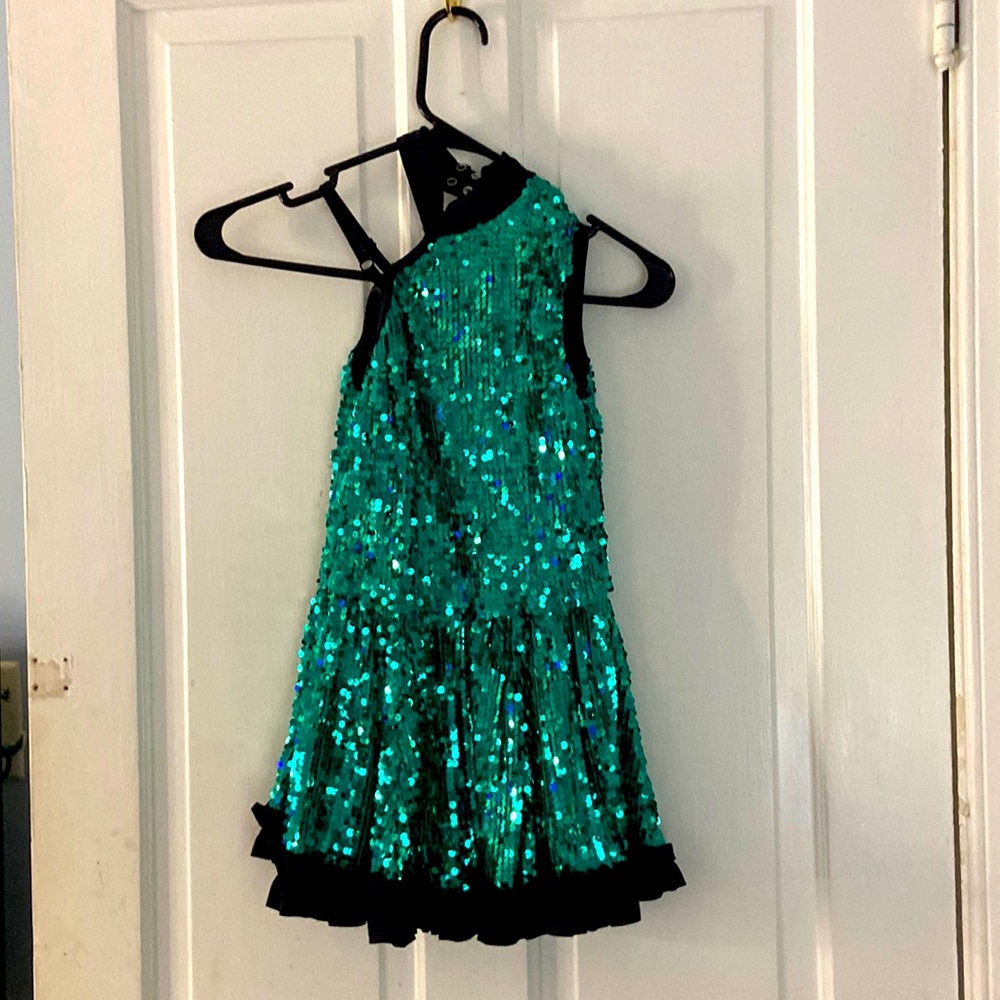 This is a very fun sequined dress with shorts underneath. It has a 4 way stretch